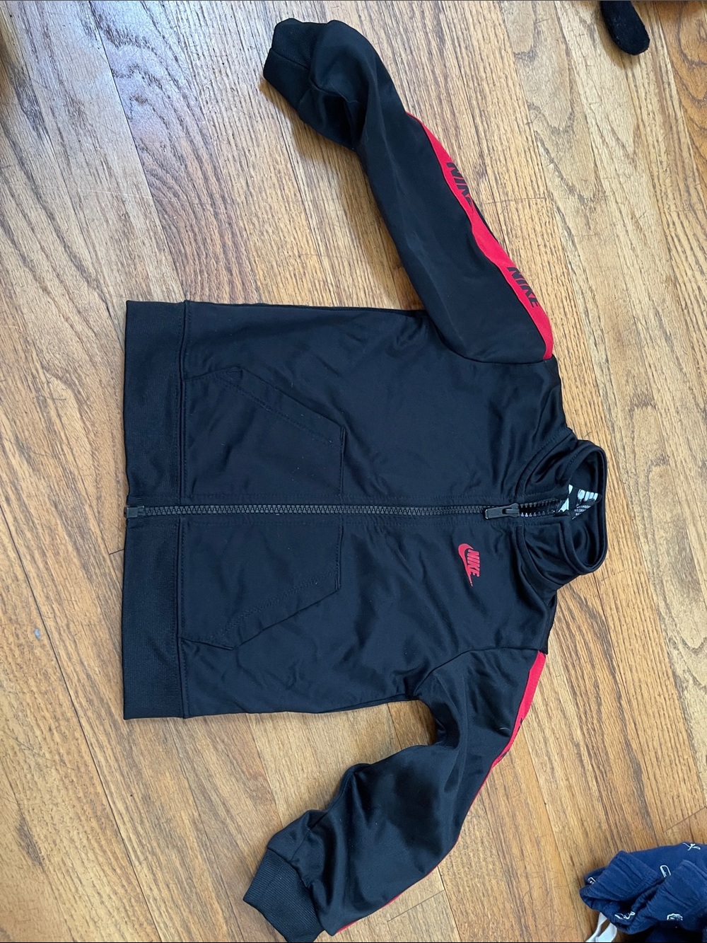 Nike Black Jacket with Red Shoulder Stripes